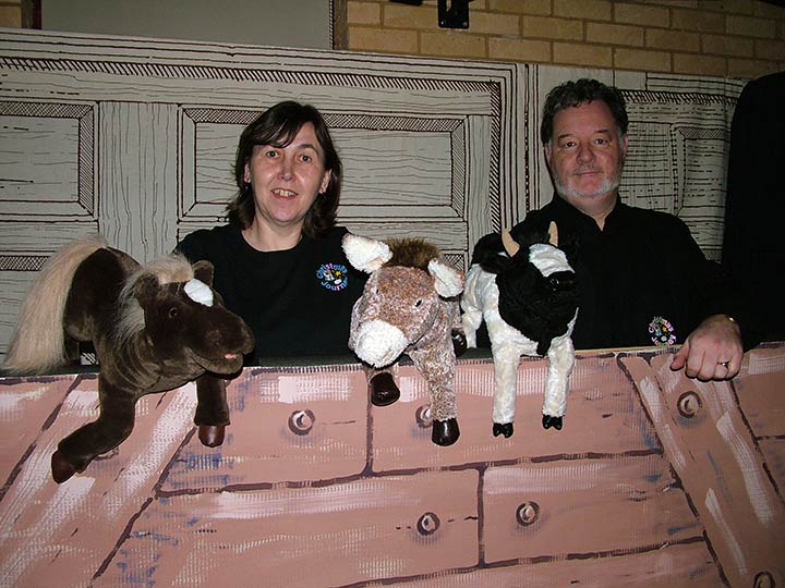 Cow, horse and donkey with their puppeteers