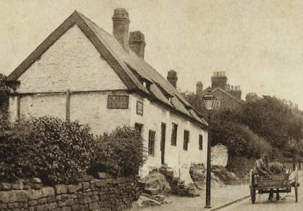 Cottages on Church Street with a passing horse and cart