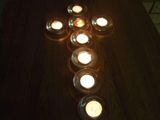 Candles laid out as a cross